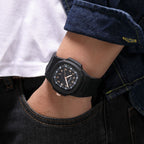MEGIR 8119 quartz watch on the wrist, black case, rose-gold Arabic numerals and black silicone strap