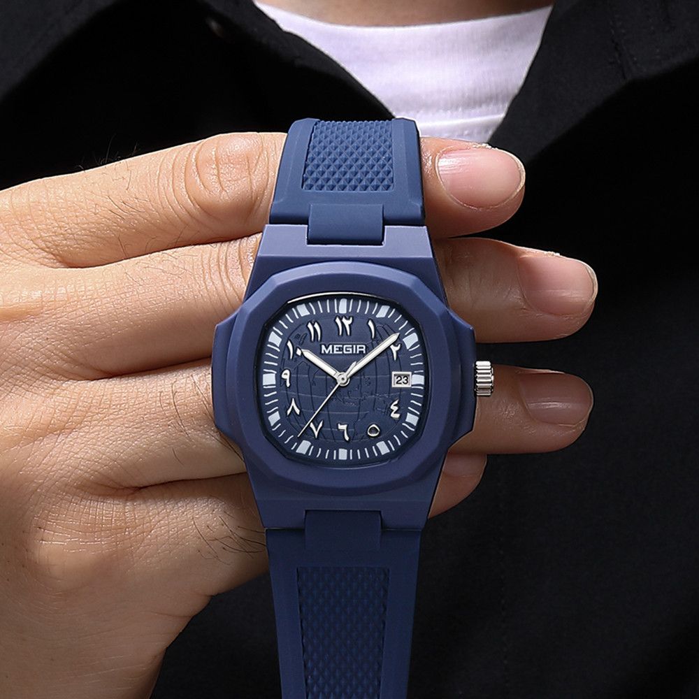 MEGIR 8119 quartz watch held in hand, navy blue case, blue dial and blue silicone strap