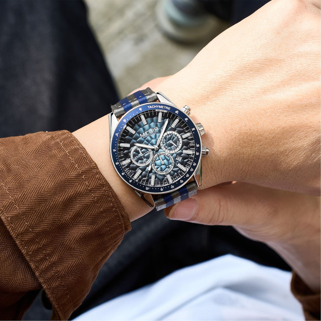 MEGIR 8121 chronograph watch on the wrist, silver case, blue dial and grey-blue nylon strap