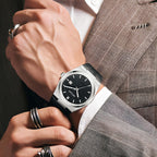 MEGIR 8406 quartz watch on the wrist, silver case, black textured dial and black leather strap