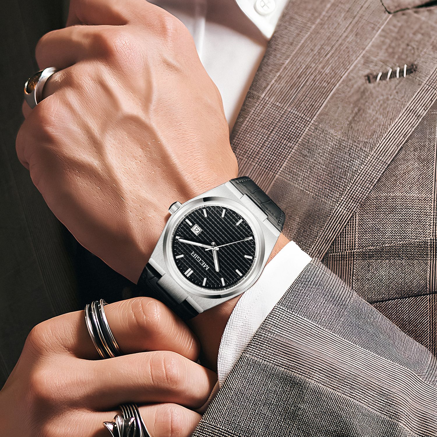 MEGIR 8406 quartz watch on the wrist, silver case, black textured dial and black leather strap