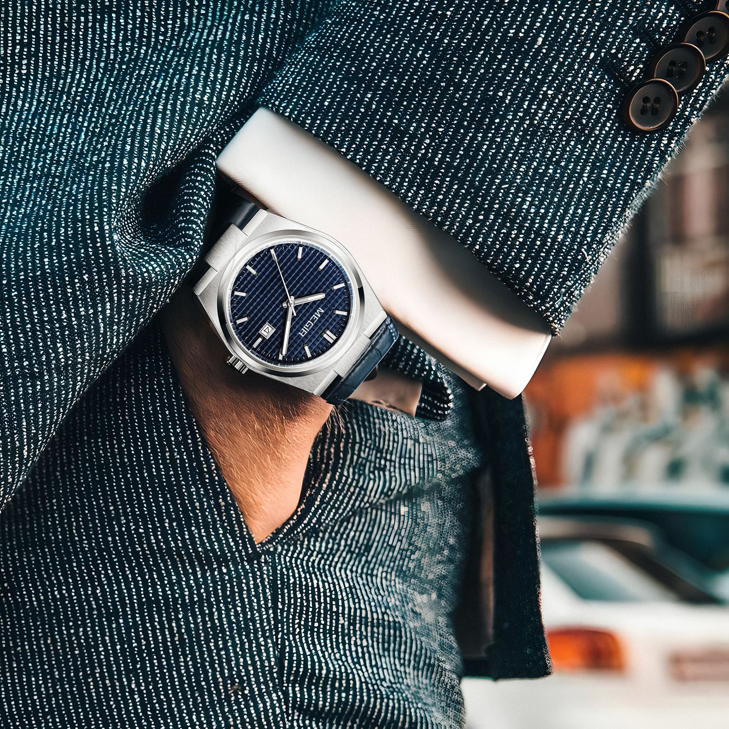 MEGIR 8406 quartz watch on the wrist, silver case, blue textured dial and blue leather strap