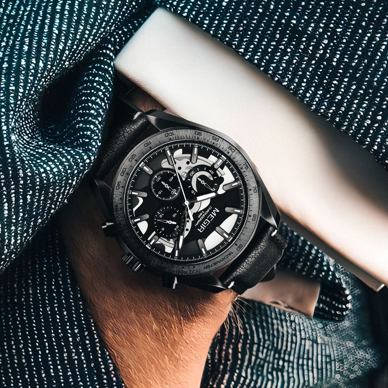 MEGIR 8408 chronograph watch on the wrist, black case, black dial and black leather strap