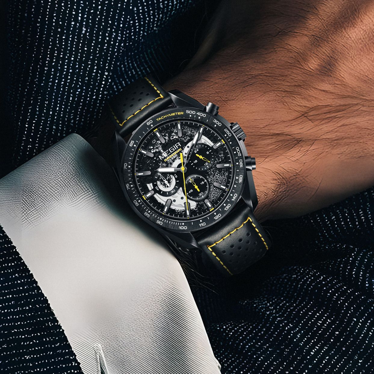 MEGIR 8408 chronograph watch on the wrist, black case, yellow-accented dial and black leather strap
