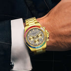 Men's chronograph watch on the wrist, gold case, rainbow crystal bezel and grey dial