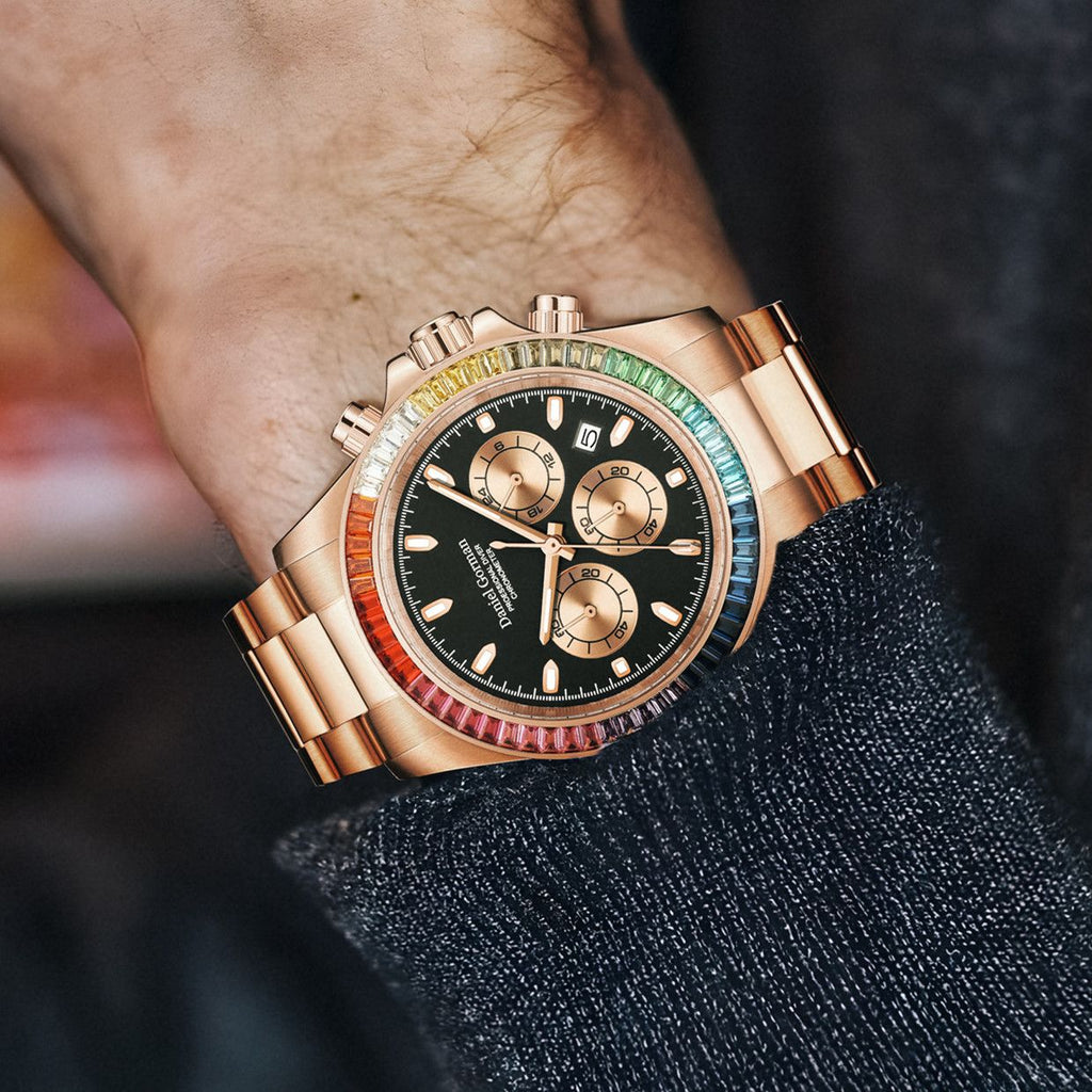Men's chronograph watch on the wrist, rose-gold case, rainbow crystal bezel and black dial