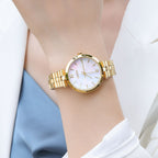 MEGIR 85112 women's quartz watch on the wrist, gold case, mother-of-pearl dial and gold steel bracelet