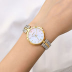 MEGIR 85112 women's quartz watch on the wrist, gold case and two-tone gold and silver steel bracelet