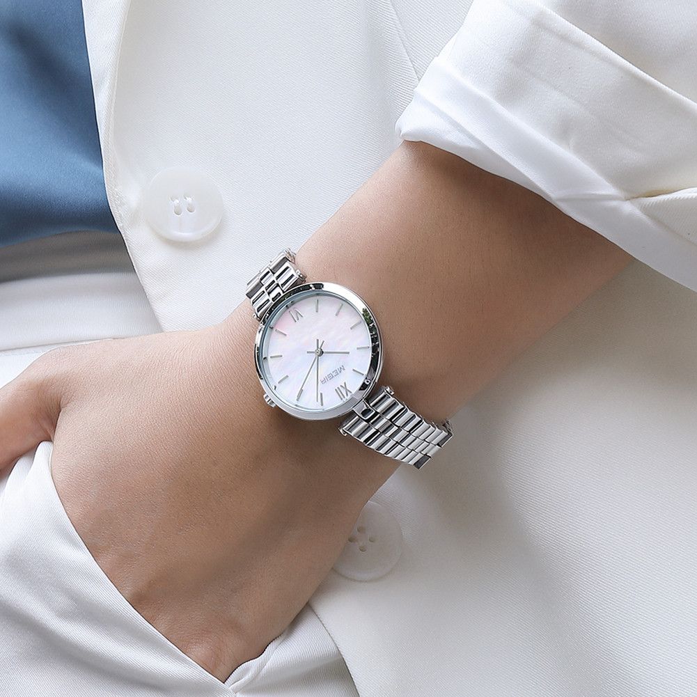 MEGIR 85112 women's quartz watch on the wrist, silver case, mother-of-pearl dial and steel bracelet