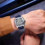 MEGIR 8601 skeleton automatic watch on the wrist, silver case, blue accents and blue silicone strap