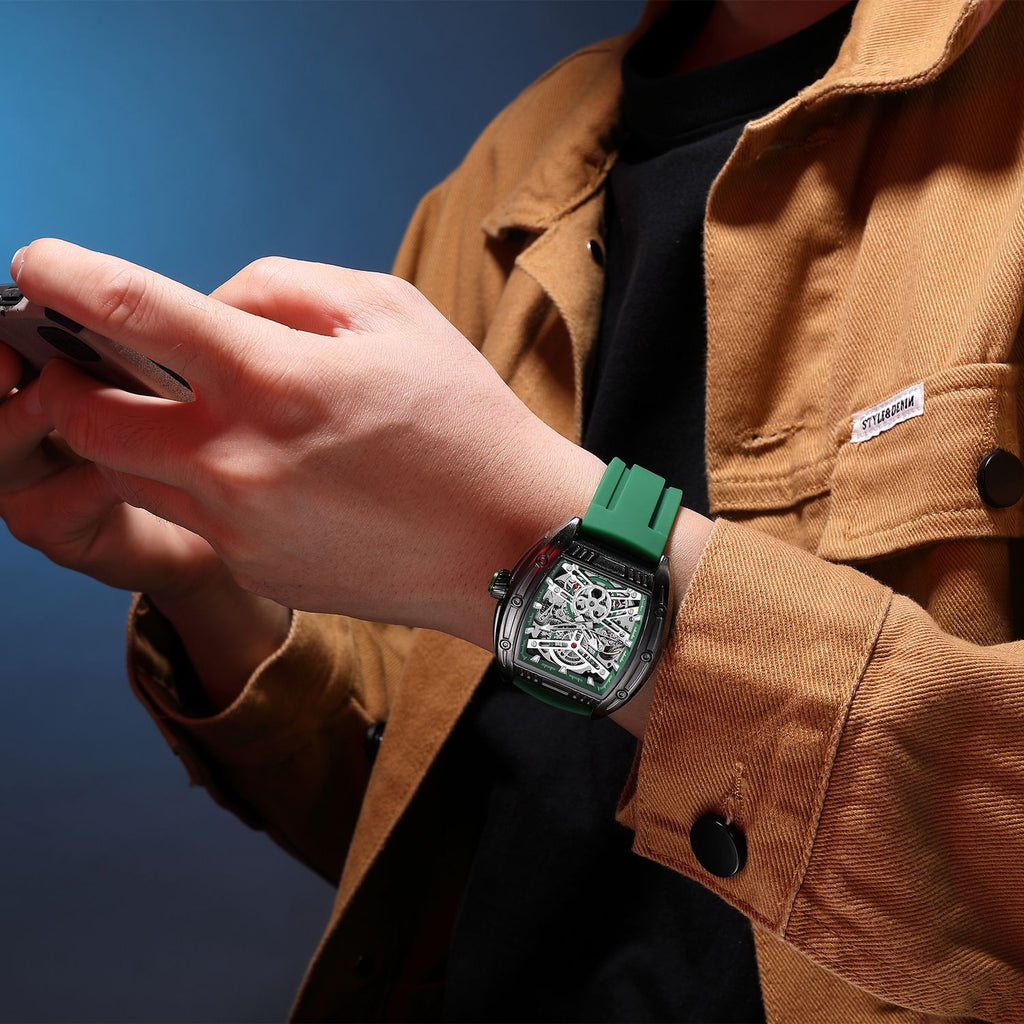 MEGIR 8601 skeleton automatic watch on the wrist, black case, green accents and green silicone strap