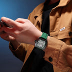 MEGIR 8601 skeleton automatic watch on the wrist, black case, green accents and green silicone strap