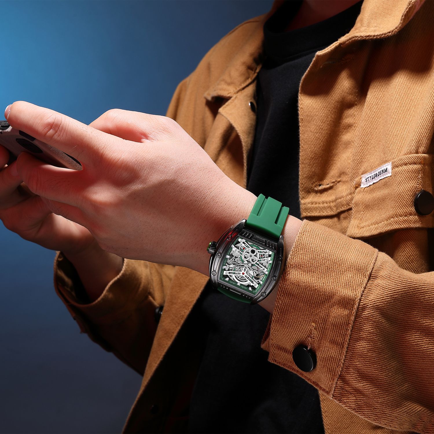 MEGIR 8601 skeleton automatic watch on the wrist, black case, green accents and green silicone strap