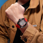 MEGIR 8601 skeleton automatic watch on the wrist, black case, red accents and red silicone strap