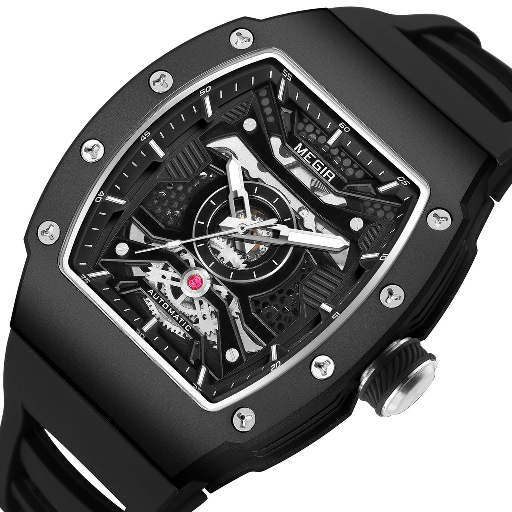 MEGIR 8604 skeleton automatic watch, black case, openwork dial and black silicone strap, angled view