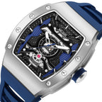 MEGIR 8604 skeleton automatic watch, silver case, blue accents and blue silicone strap, angled view