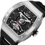 MEGIR 8604 skeleton automatic watch, silver case, openwork dial and black silicone strap, side angle
