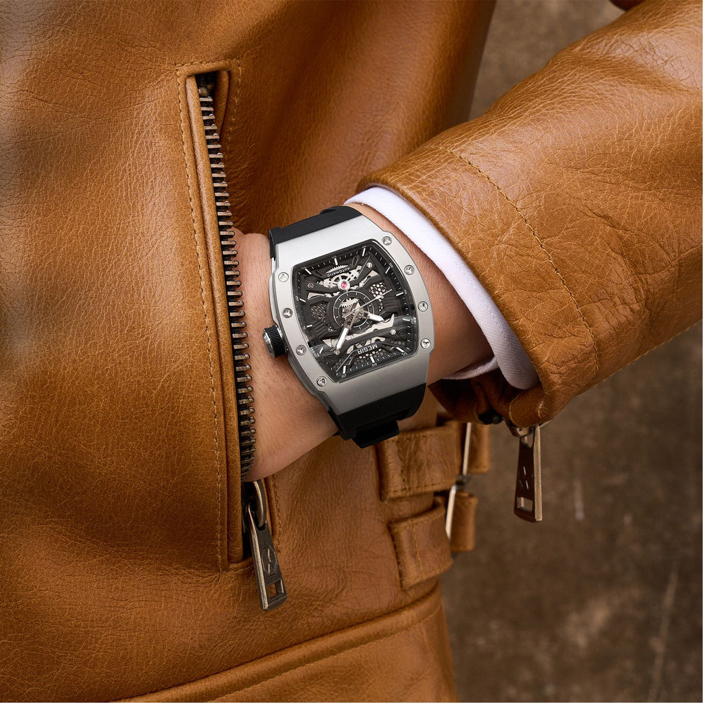 MEGIR 8604 skeleton automatic watch on the wrist, silver case and black silicone strap