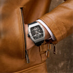 MEGIR 8604 skeleton automatic watch on the wrist, silver case and black silicone strap