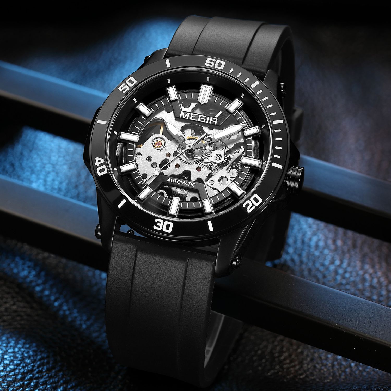 MEGIR 8605 skeleton automatic watch, black case, black bezel and black strap, blue-lit beauty shot