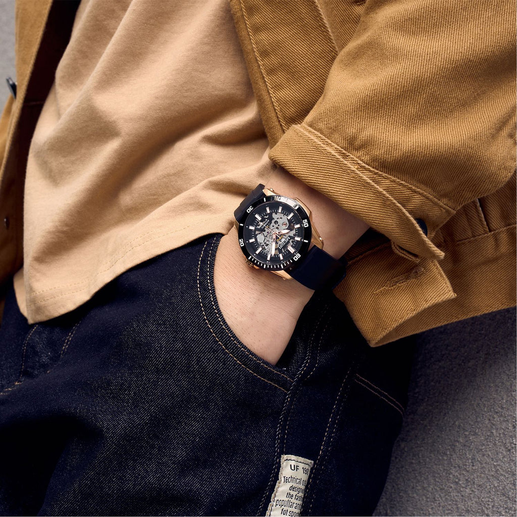 MEGIR 8605 skeleton automatic watch on the wrist, rose-gold case, black bezel and dark silicone strap