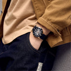 MEGIR 8605 skeleton automatic watch on the wrist, rose-gold case, black bezel and dark silicone strap