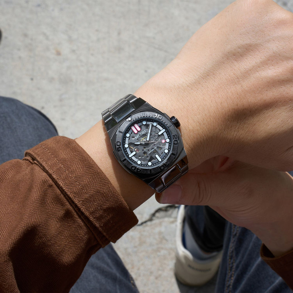 MEGIR 8606 skeleton automatic watch on the wrist, gunmetal case, black bezel and dark steel bracelet