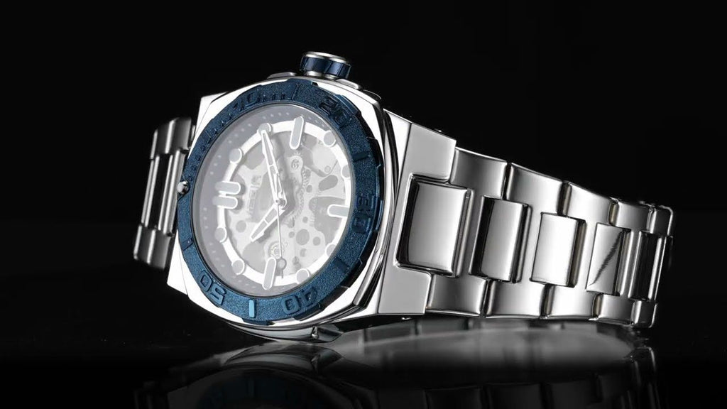 MEGIR 8606 skeleton automatic watch, silver case, blue bezel and steel bracelet, angled beauty shot