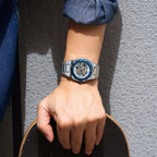 MEGIR 8606 skeleton automatic watch on the wrist, silver case, blue bezel and steel bracelet