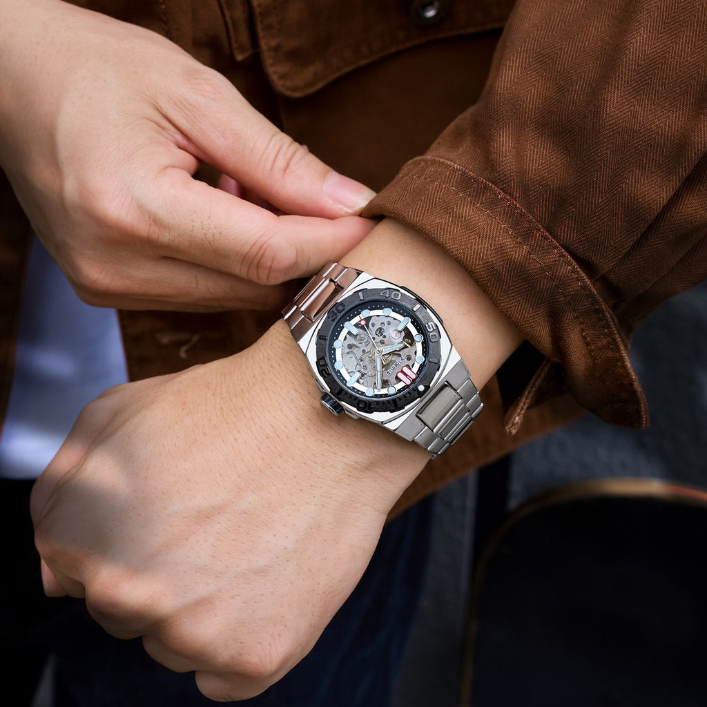 MEGIR 8606 skeleton automatic watch on the wrist, silver case, black bezel and steel bracelet