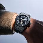 MEGIR 9005-4 skeleton automatic watch on the wrist, black octagonal case and integrated black bracelet
