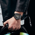 MEGIR 9190-11 skeleton automatic watch on the wrist, black case and black silicone strap