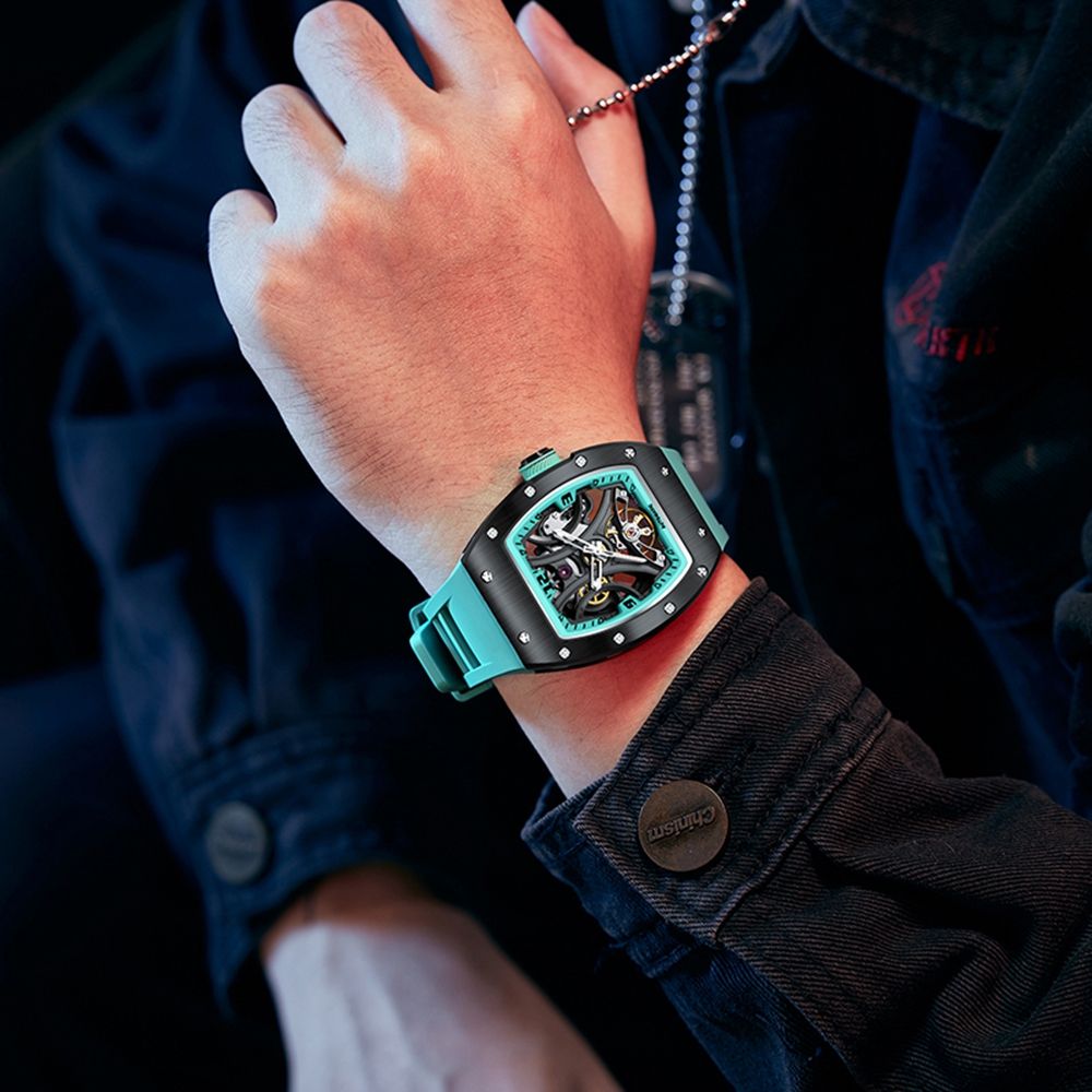 MEGIR 9190-11 skeleton automatic watch on the wrist, black case, turquoise inner ring and turquoise silicone strap