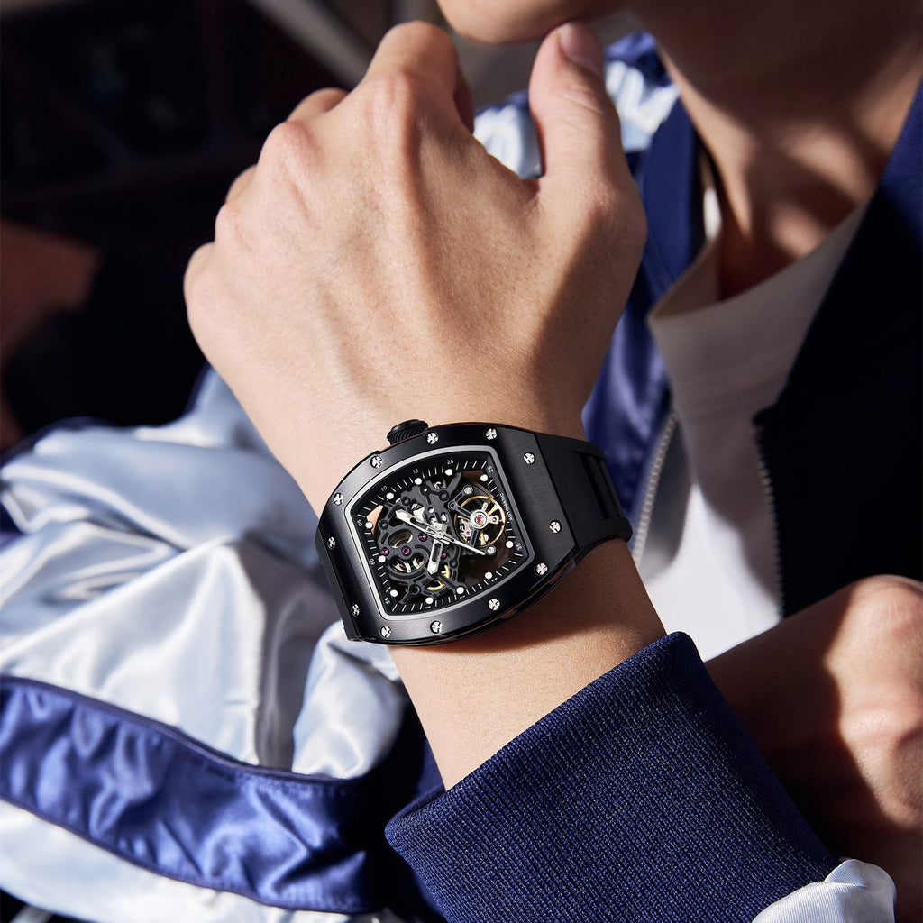 MEGIR 9190-12 skeleton automatic watch on the wrist, black case and black silicone strap