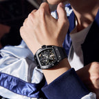 MEGIR 9190-12 skeleton automatic watch on the wrist, black case and black silicone strap