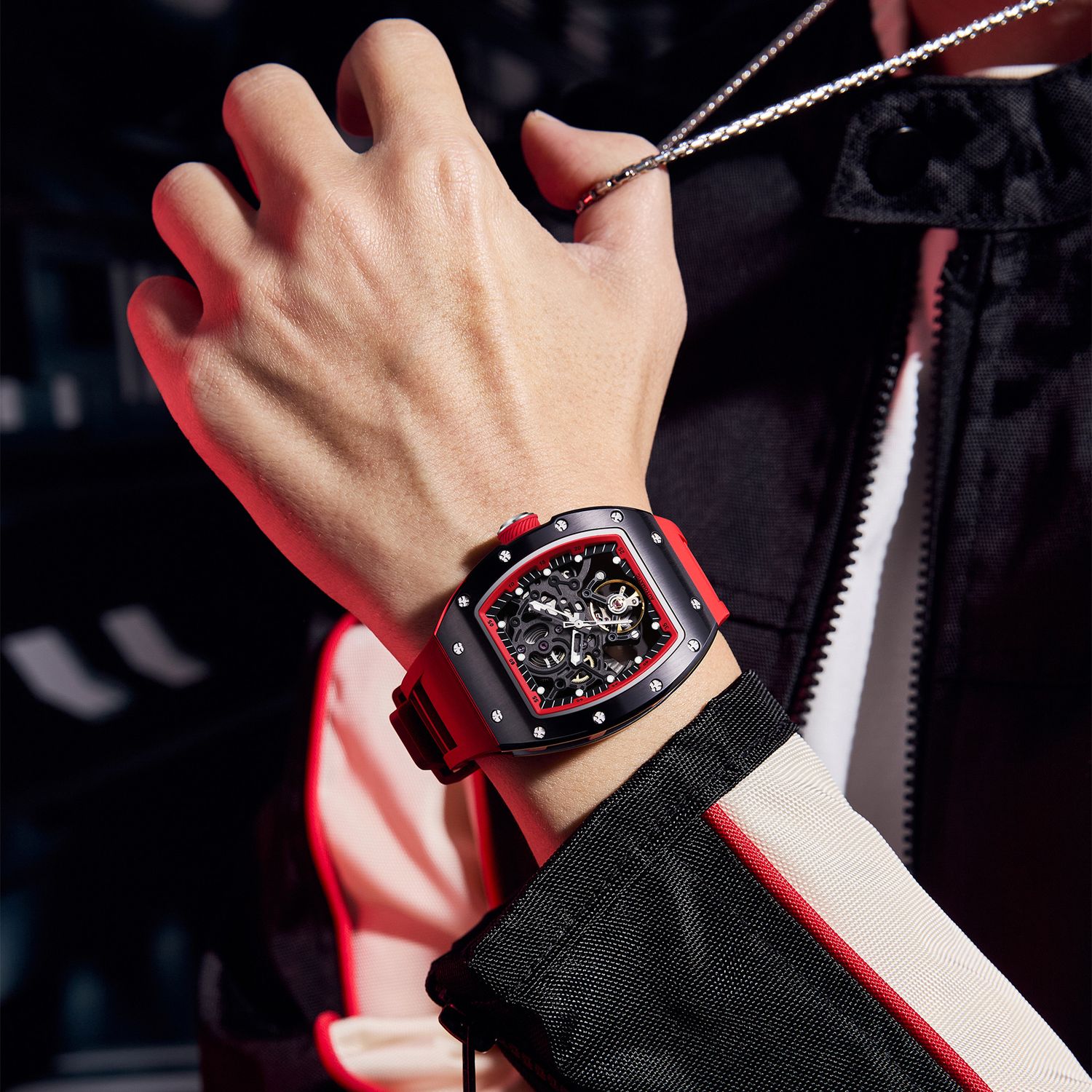 MEGIR 9190-12 skeleton automatic watch on the wrist, black case, red accents and red silicone strap