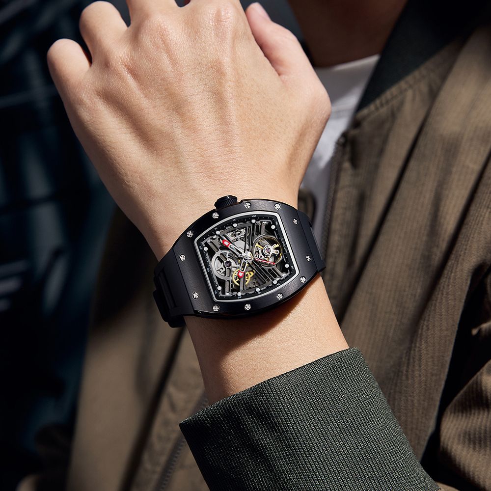 MEGIR 9190-13 skeleton automatic watch on the wrist, black case and black silicone strap