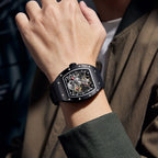 MEGIR 9190-13 skeleton automatic watch on the wrist, black case and black silicone strap