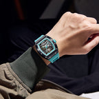 MEGIR 9190-13 skeleton automatic watch on the wrist, black case, blue bezel and blue silicone strap