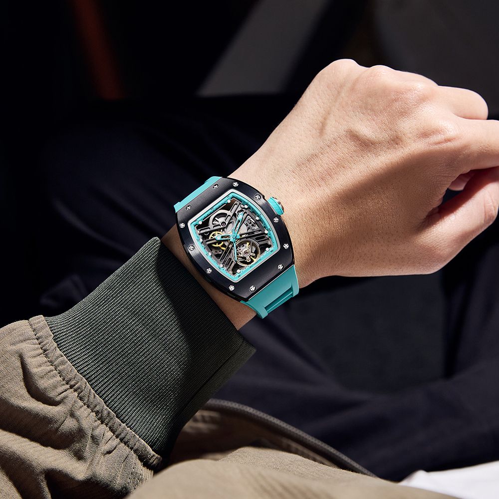 MEGIR 9190-13 skeleton automatic watch on the wrist, black case, blue bezel and blue silicone strap