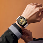 MEGIR 9190-15 dragon skeleton automatic watch on the wrist, black case, gold dragon dial and white strap