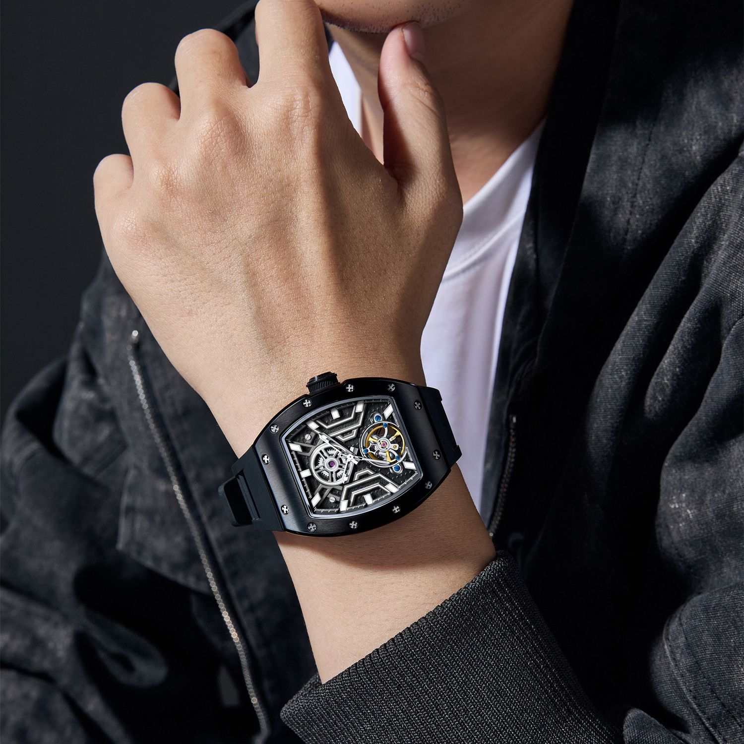 MEGIR 9190-28 skeleton automatic watch on the wrist, black case and black silicone strap