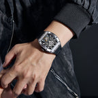MEGIR 9190-28 skeleton automatic watch on the wrist, silver case and black silicone strap