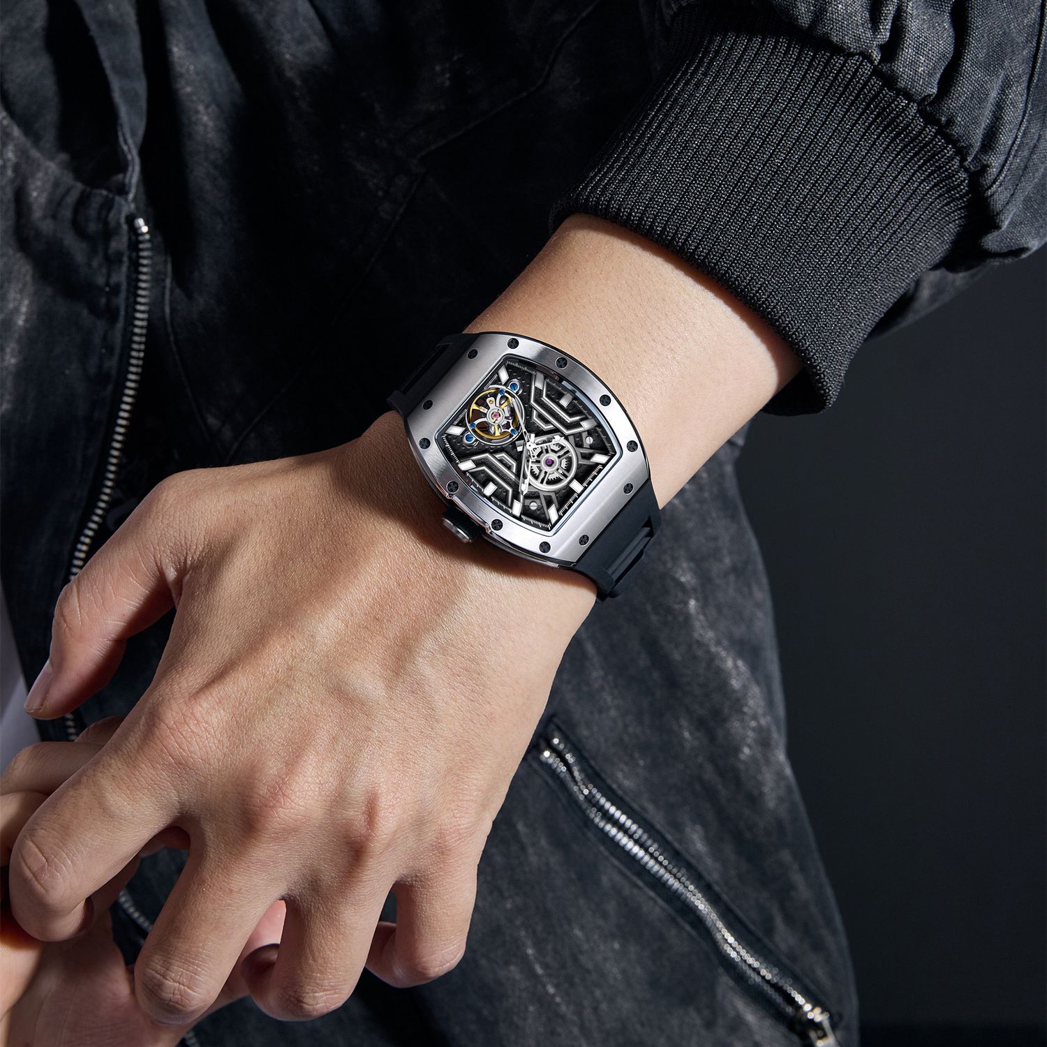 MEGIR 9190-28 skeleton automatic watch on the wrist, silver case and black silicone strap