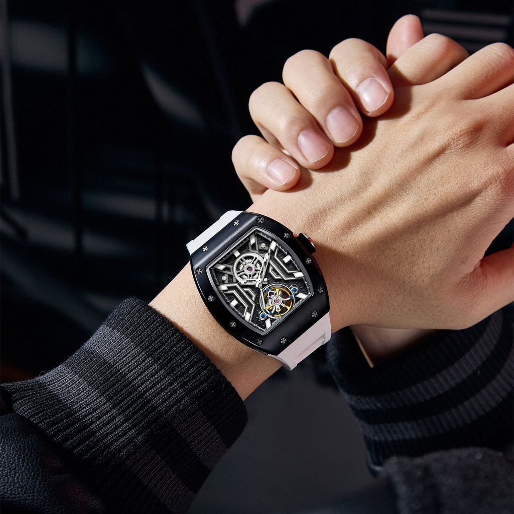 MEGIR 9190-28 skeleton automatic watch on the wrist, black case and white silicone strap