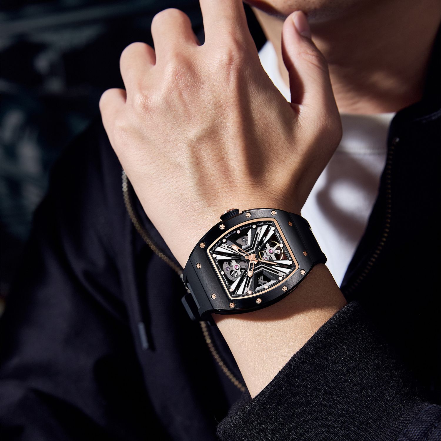 MEGIR 9190-4 skeleton automatic watch on the wrist, black case with rose-gold ring and black silicone strap