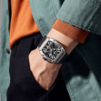 MEGIR 9190-4 skeleton automatic watch on the wrist, silver case and black silicone strap