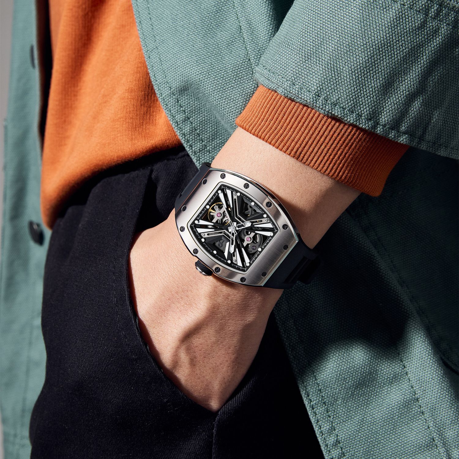 MEGIR 9190-4 skeleton automatic watch on the wrist, silver case and black silicone strap