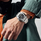 MEGIR 9190-4 skeleton automatic watch on the wrist, silver case and white silicone strap