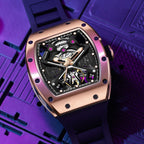 MEGIR 9190-5 spider skeleton automatic watch, rose-gold case and black strap, purple-lit beauty shot